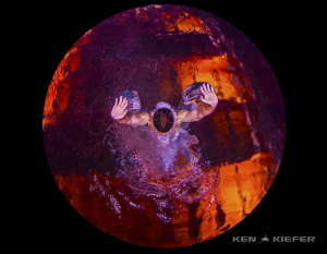 A competitve diver enters the water at around 40 miles pe... by Ken Kiefer 